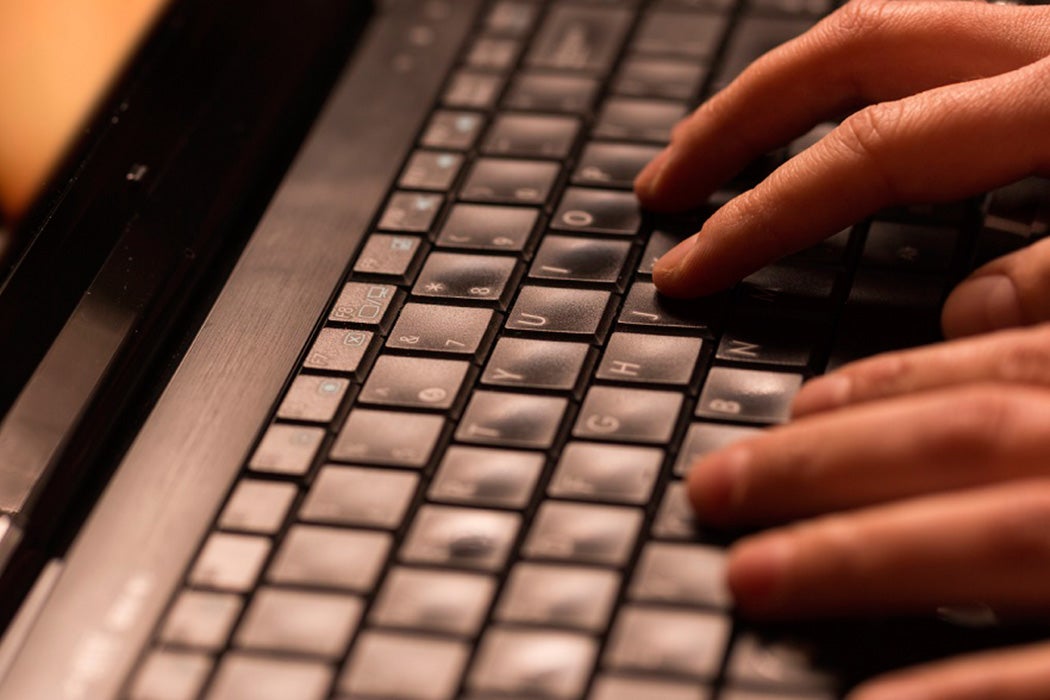 Hands on a computer keyboard