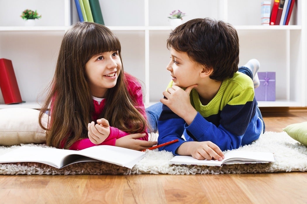 Two children talking together