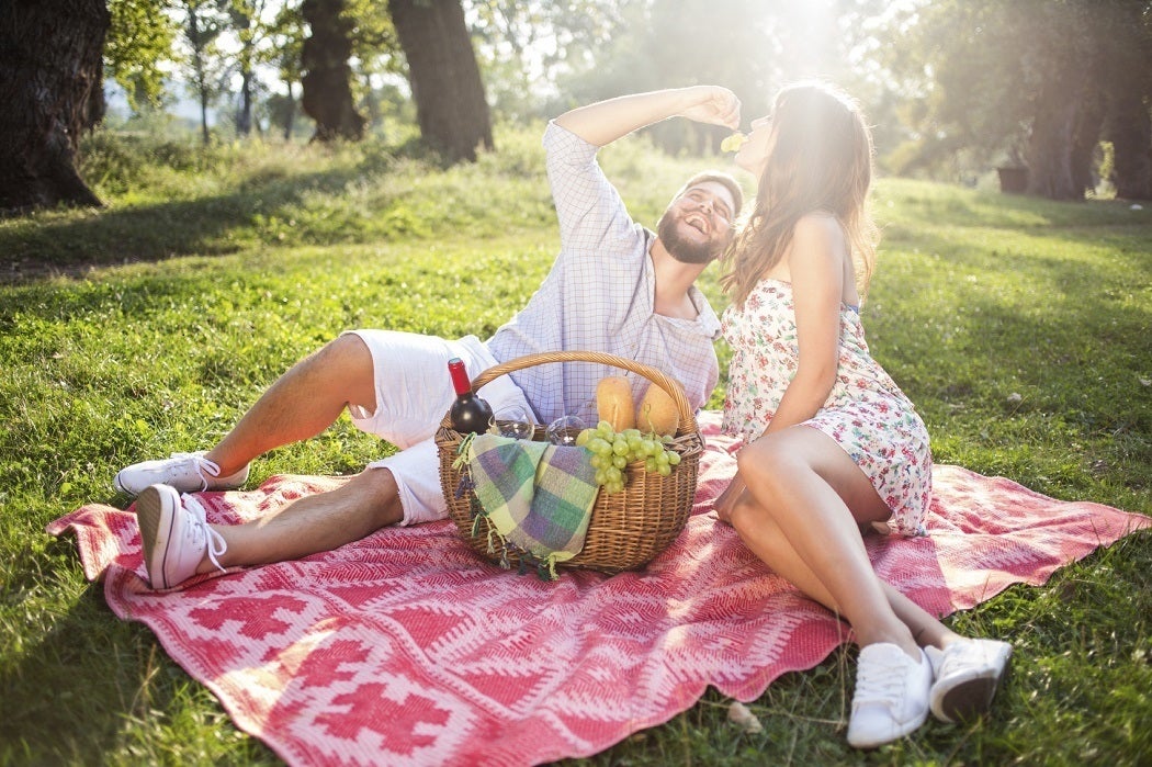 A couple in love at a picnic in the woods