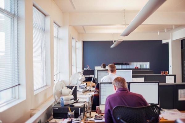 Row of workers at their desks