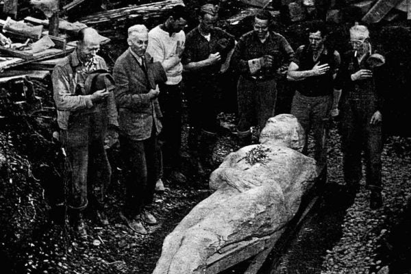 Workers are dwarfed by the 10-foot Cardiff Giant as they dig him out of his "grave" in Cardiff, N.Y., in this 1869 file photo. AP Photo/Farmers Museum, HO)