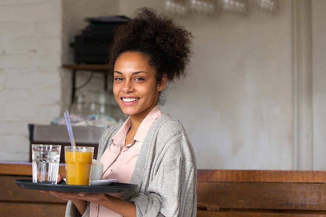 Smiling waitress making minimum wage.