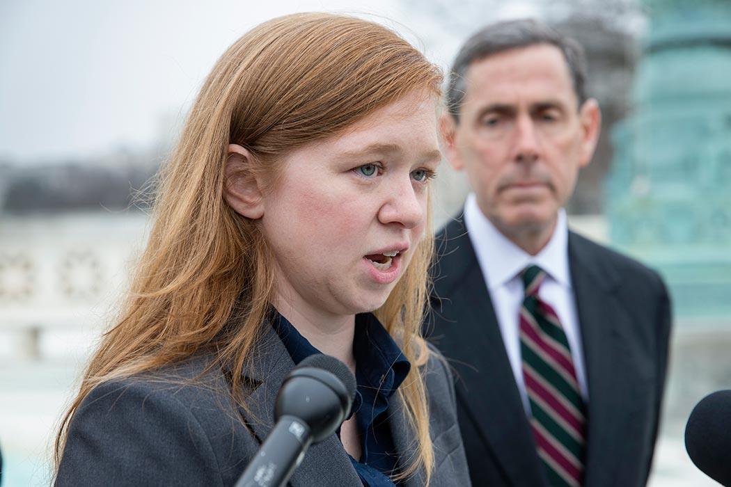 Abigail Fisher, who challenged the use of race in college admissions, joined by lawyer Edward Blum, right, speaks to reporters outside the Supreme Court in Washington, Wednesday, Dec. 9, 2015, following oral arguments in the Supreme Court in a case that could cut back on or even eliminate affirmative action in higher education. (AP Photo/J. Scott Applewhite)