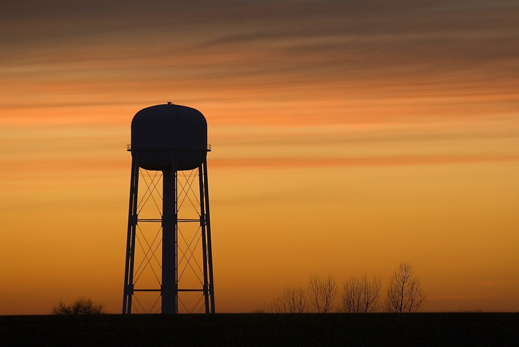 A water tower at sunset.