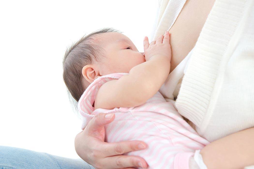 A mother breastfeeding her child.