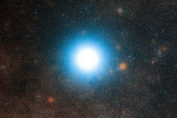 The bright star Alpha Centauri and its surroundings