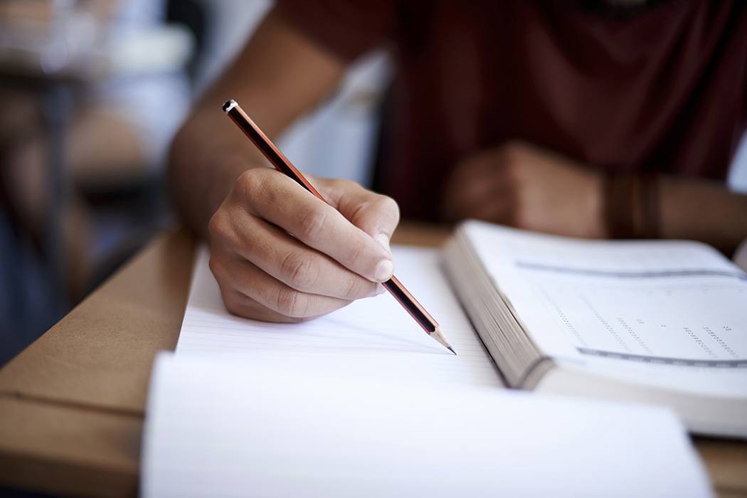 Close-up on a pencil as a student studies