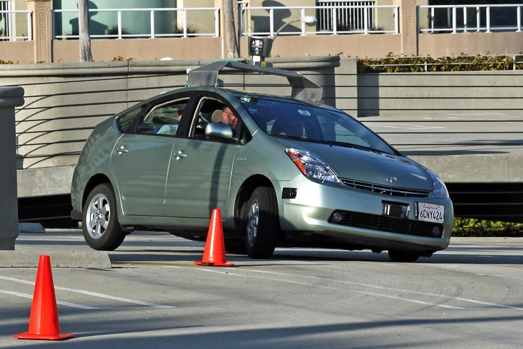 Self driving car navigating its way around safety cones