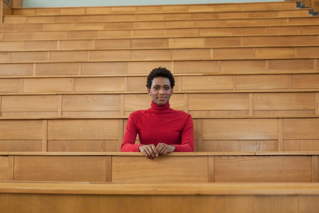 A university student sitting in an auditorium