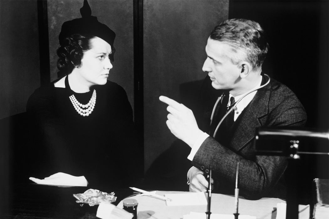 A doctor talking to a female patient