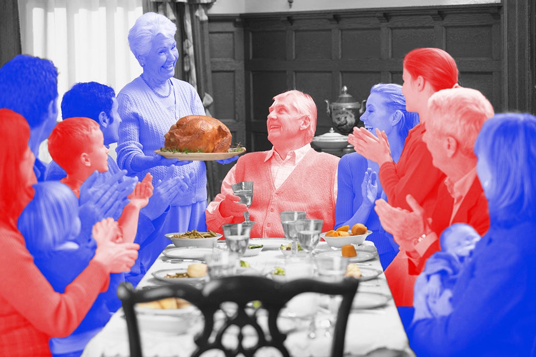 A family around a thanksgiving dinner table, colored red and blue