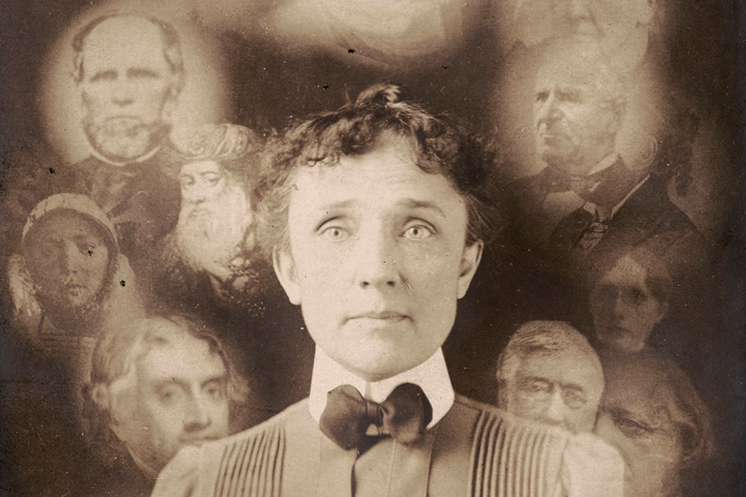 "Spirit" photograph, supposedly taken during a seance, actually a double exposure or composite of superimposed cut-outs, showing woman with portraits of men and women around her head