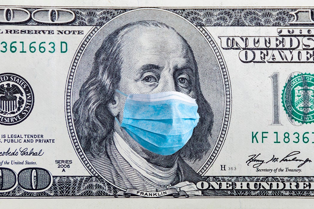 A 100 dollar banknote with medical mask.