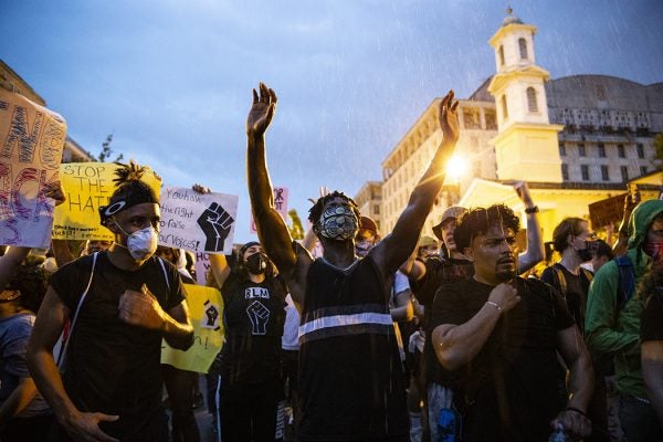 People gather in the rain outside of the White House for a peaceful protest against police brutality on June 4, 2020 in Washington, DC.