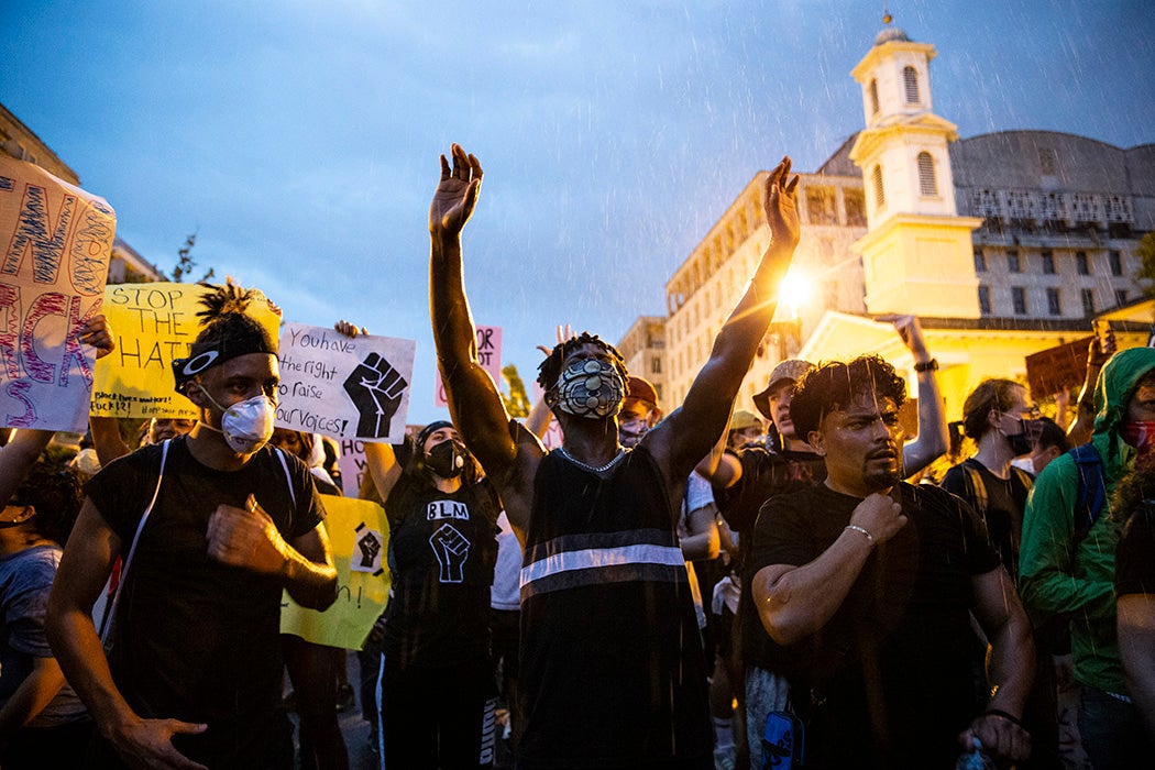 People gather in the rain outside of the White House for a peaceful protest against police brutality on June 4, 2020 in Washington, DC.