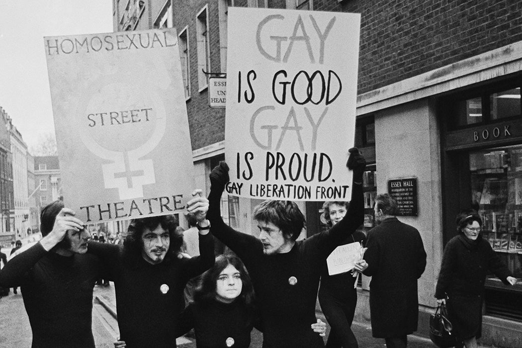 Members of the United Kingdom branch of the Gay Liberation Front carry placards during a street protest along Essex Street in London on 12th February 1971.