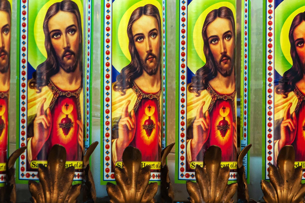 Religious candles placed by religious devotees at a Catholic shrine in San Antonio, Texas.