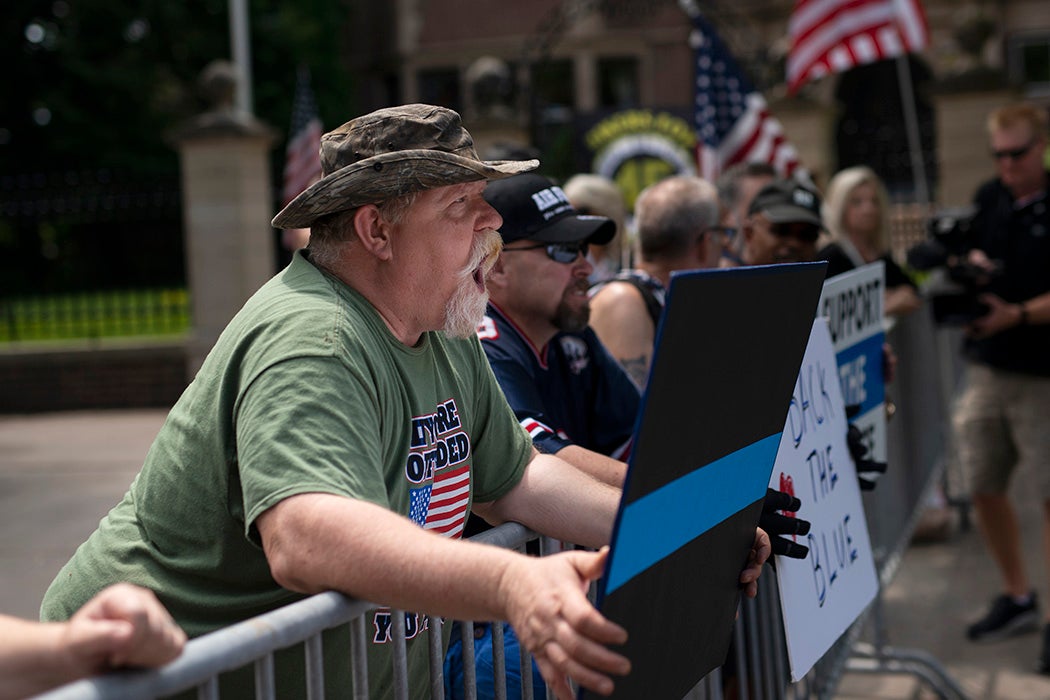 Pro-police demonstrators argue across a temporary barricade during a protest outside the Governors Mansion on June 27, 2020 in St Paul, Minnesota.