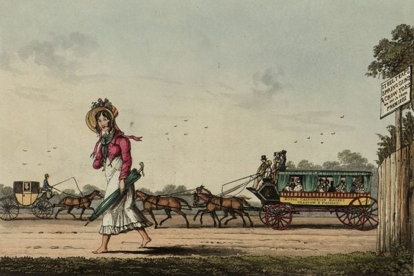 A barefoot pedestrian is overtaken by the Royal Caledonian Basket on a road near Glasgow.