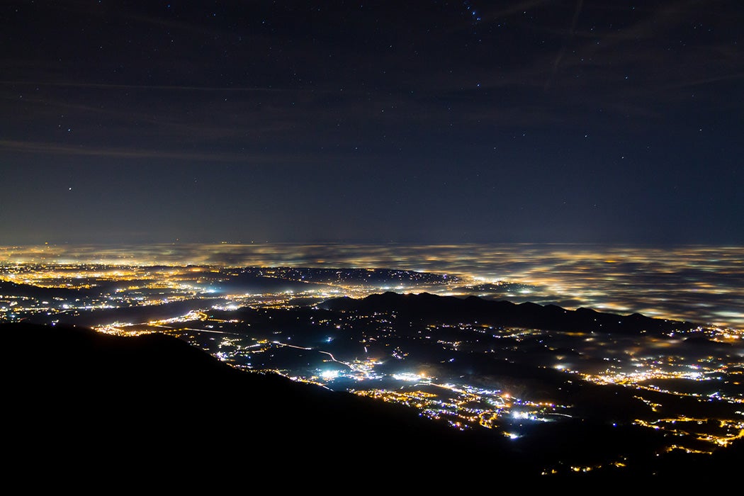 Plain illuminated partially covered by fog, soft lights