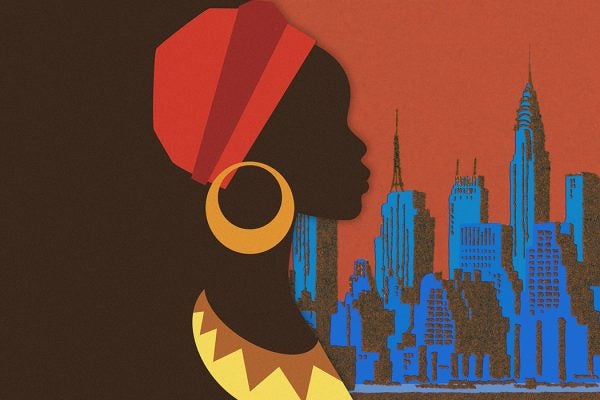 A person in African clothing with New York City in the background