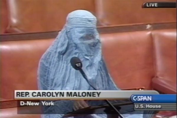 Rep. Carolyn Maloney (D-NY) wears a traditional Afghani burqa while giving a speech in support of Afghan women's rights and American involvement against Taliban in the United States House of Representatives, October 16, 2001