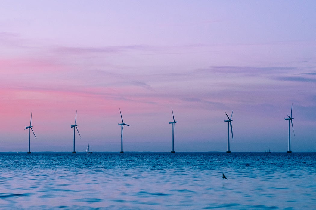 Scenic View Of Wind Turbines Against Sky During Sunset