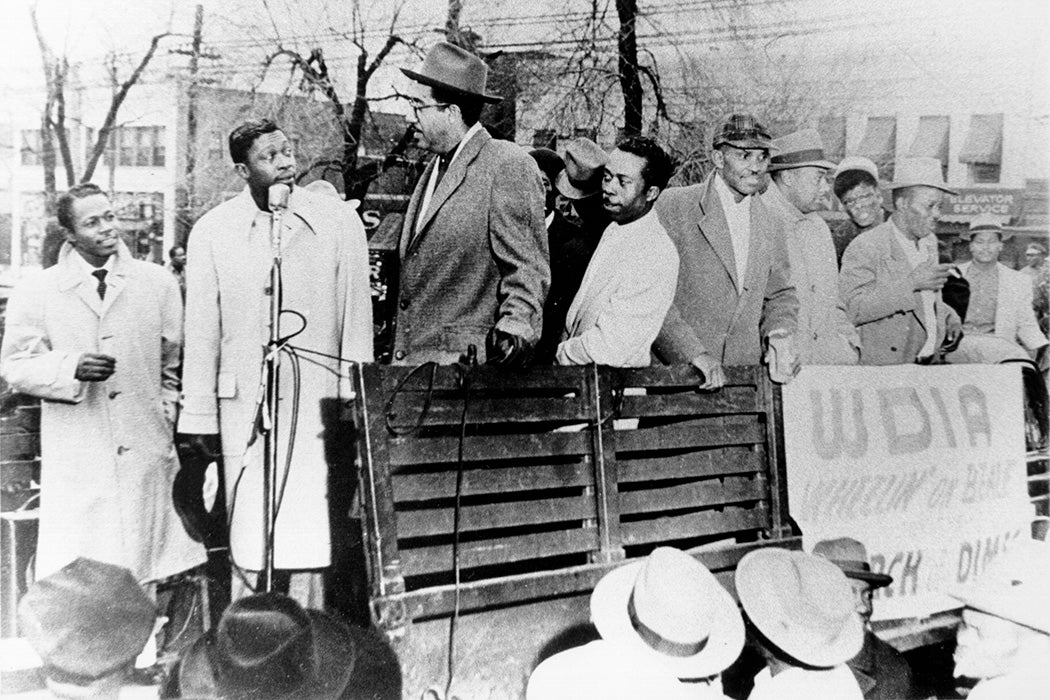 Blues musician B.B. King stands on the back of a truck with other African-American men to raise money for radio station WDIA's Wheelin' On Beale March of Dimes charity for pregnancy and baby health in circa 1955 in Memphis, Tennessee.