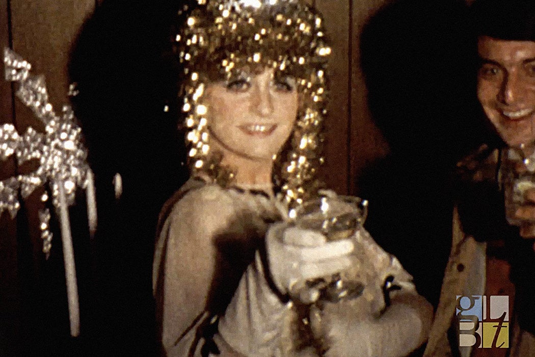 Film still from a 1960s drag cocktail party, picnic, and pool party, c. 1968-1969