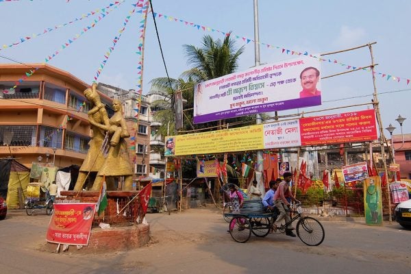 A statue of a refugee family marks the crossroads of Netaji Nagar