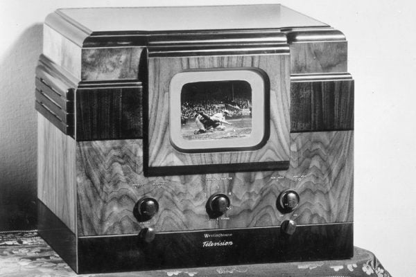 A baseball game plays on an early television set, c. 1947