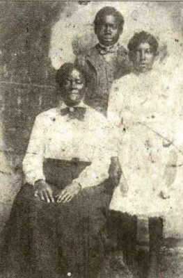 Sarah (left), Sylvester (standing), and Willie Carrier (right), c. 1910