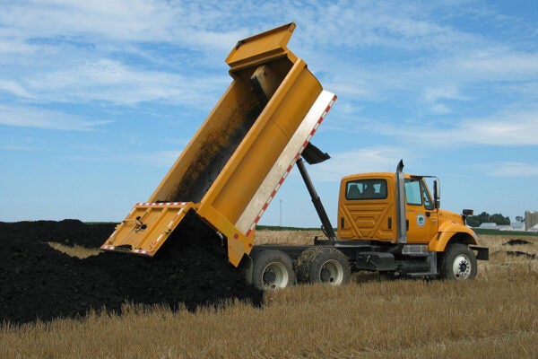 A truck dumping biosolids in Geneva, Illinois