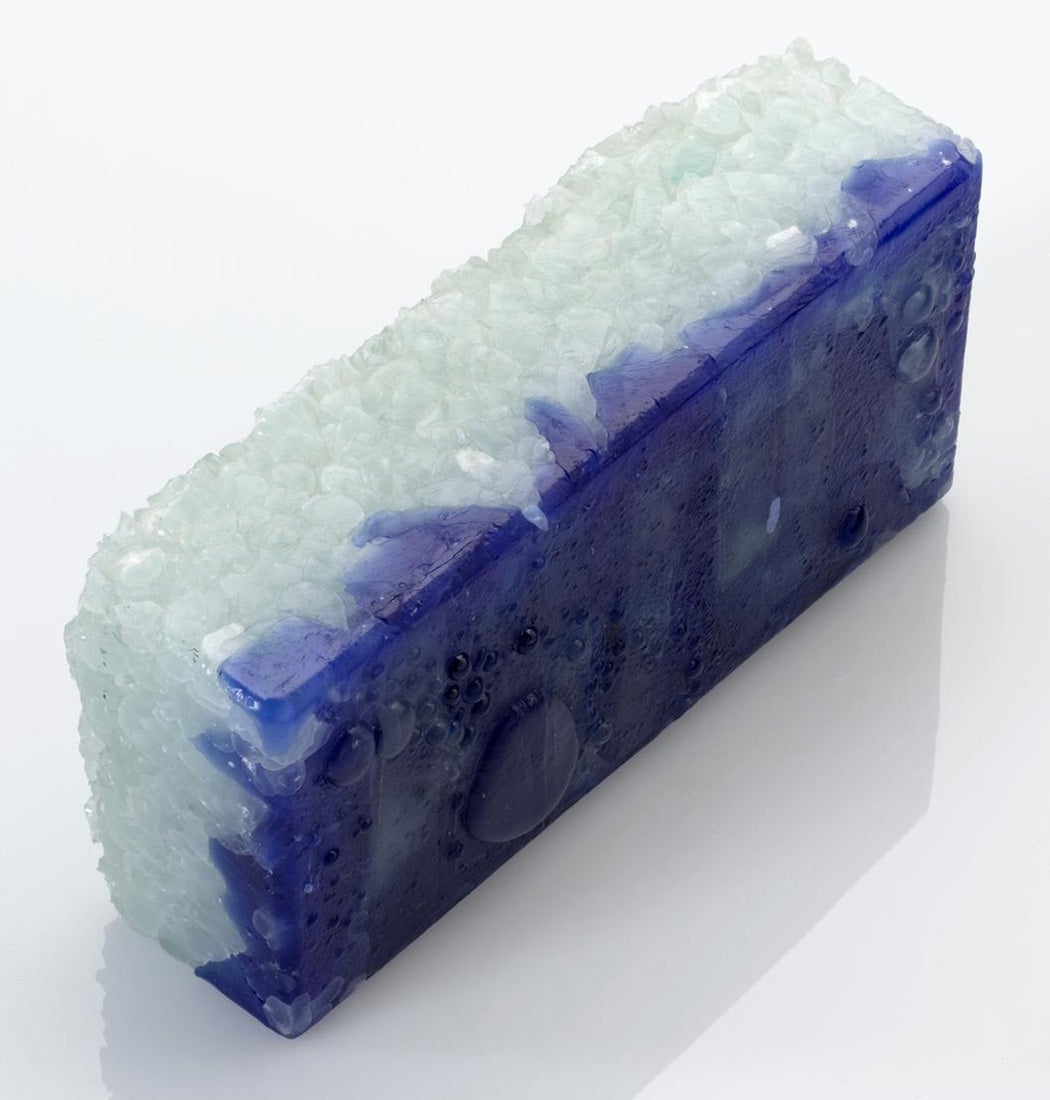 Recycled blue glass brick made from blue bottle mix with natural water droplet surface; made by David Watson in his Brighton Workshop in 1999