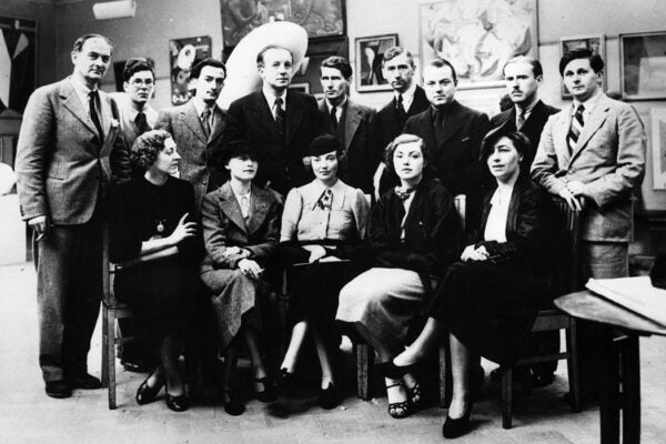 Surrealist artists at the first Surrealist Exhibition to be held in London. Back row, from left, are Rupert Lee, Ruthven Todd, Salvador Dali, Paul Eluard, Roland Penrose, Herbert Read, E LT Mesens, George Reavey and Hugh Sykes-Davies. Front row, from left, Diana Lee, Nusch Eluard, Eileen Agar, Sheila Legge and unknown.