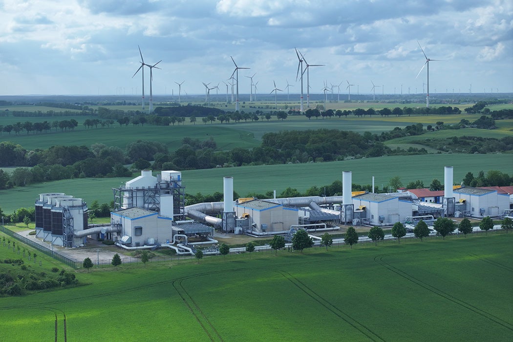 A compressor station of the Jagal natural gas pipeline stands as wind turbines spin behind on May 24, 2023 near Mallnow, Germany.