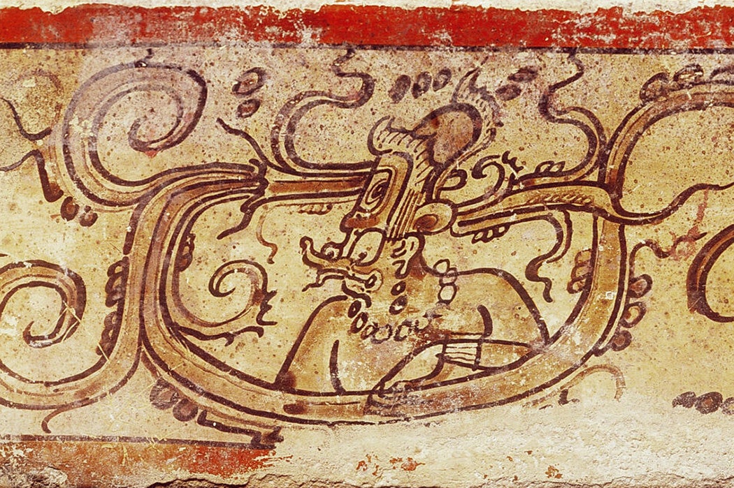 An illustration of K'awiil, the Maya god of storm, on pottery.