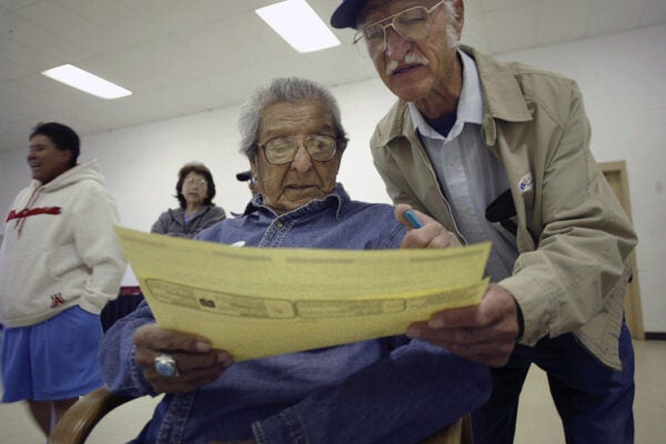 Wilbert Hunt, 97, the oldest member of the Pueblo of Acoma, casts his ballot at the Acoma Tribal Center in Acoma, New Mexico, 2004